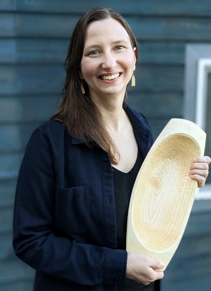 Kaylyn Messer with a hand-carved balance bowl